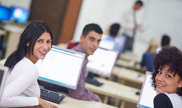 students in a classroom with computers